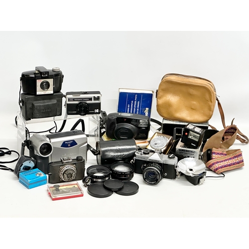 425 - A collection of vintage cameras and accessories.