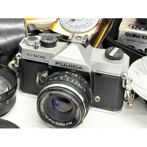 425 - A collection of vintage cameras and accessories.