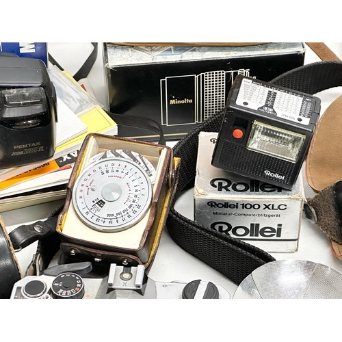 425 - A collection of vintage cameras and accessories.