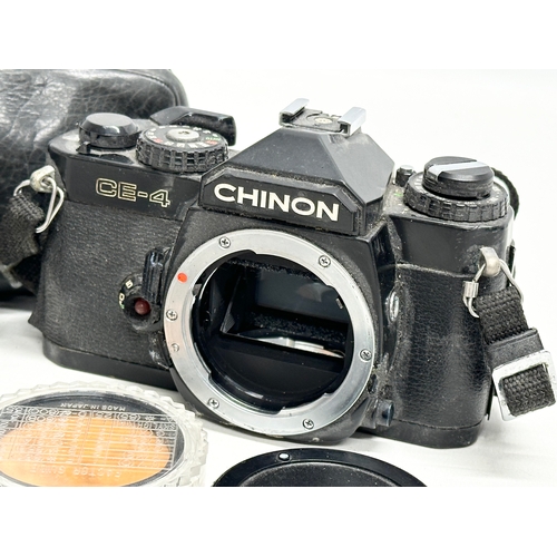 426 - 2 vintage cameras and accessories. A Chinon CE-4 camera. A Minolta Repo Rokkor camera.