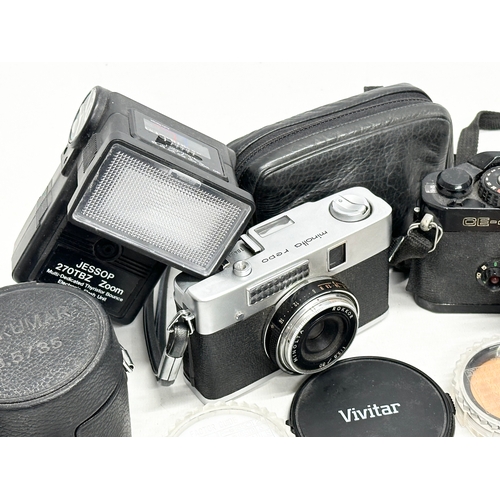 426 - 2 vintage cameras and accessories. A Chinon CE-4 camera. A Minolta Repo Rokkor camera.