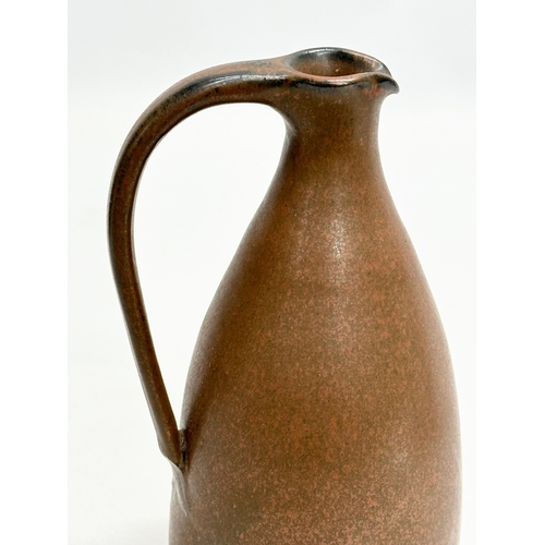 415 - Susan Cupitt. A glazed stoneware, studio pottery jug by Susan Cupitt (b.1936) 18cm