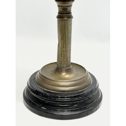 127 - A 19th Century Victorian double burner oil lamp. With reeded brass column and glass bowl. 66cm