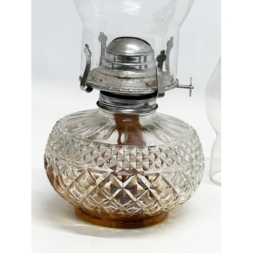 417 - 2 Early 20th Century oil lamps. 16x16x40cm. 33cm