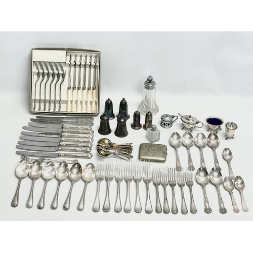 433 - A quantity of vintage silver plate. Silver plated cutlery, crust set, salt and pepper shakers, cigar... 