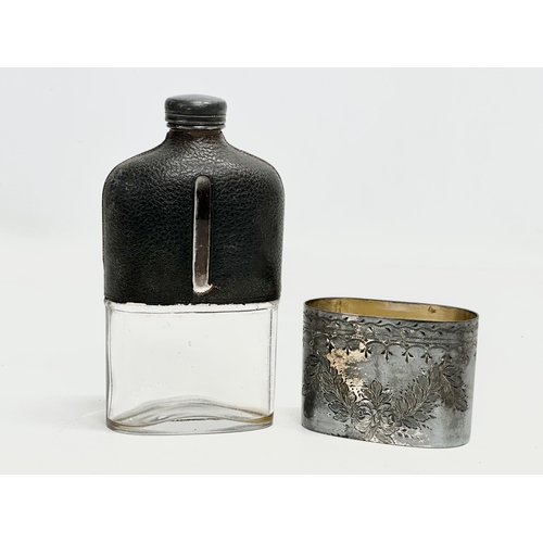 409 - A Late 19th Century Victorian silver plated and leather bound hip flask. 16cm