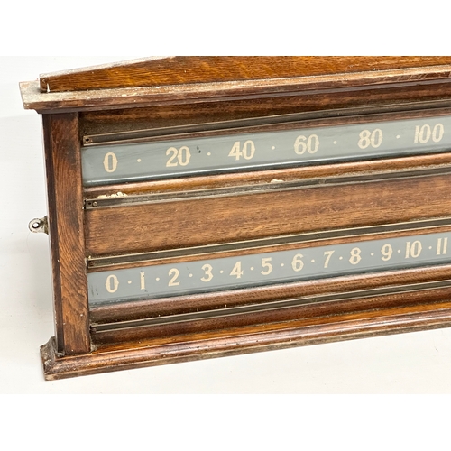 67 - E. J. Riley Limted Accrington. A Late 19th/Early 20th Century oak framed billiard scoreboard. 93x40.... 