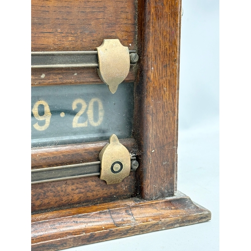 67 - E. J. Riley Limted Accrington. A Late 19th/Early 20th Century oak framed billiard scoreboard. 93x40.... 