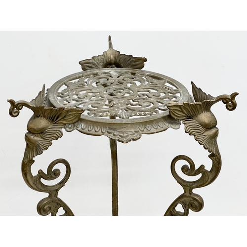 420 - A vintage brass plant stand. With mythical creatures and paw feet. 35x35x57cm