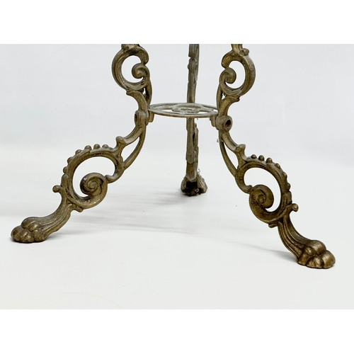 420 - A vintage brass plant stand. With mythical creatures and paw feet. 35x35x57cm