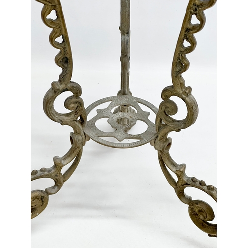 420 - A vintage brass plant stand. With mythical creatures and paw feet. 35x35x57cm