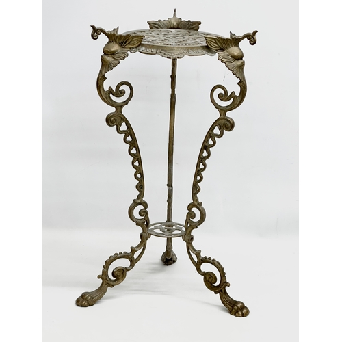 420 - A vintage brass plant stand. With mythical creatures and paw feet. 35x35x57cm