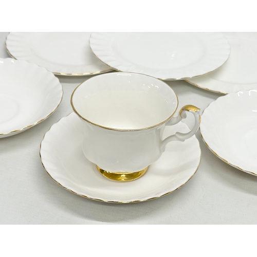 441 - A 16 piece Royal Albert “Val D’or” tea service. Including a model plane and pewter dish.