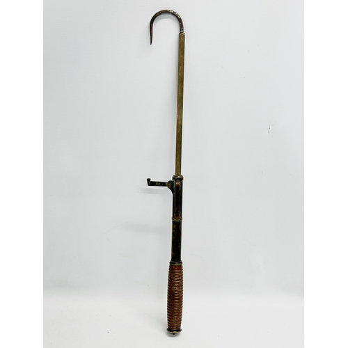 105 - An Early 20th Century Hardy’s telescopic brass fishing gaff. 87cm. 63cm. 37cm.