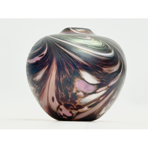 47 - A vintage iridescent art glass bulbous vase. 9.5x9.5cm.