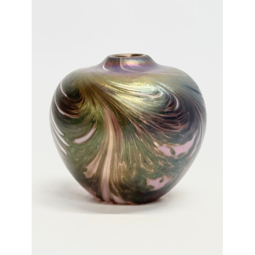 47 - A vintage iridescent art glass bulbous vase. 9.5x9.5cm.