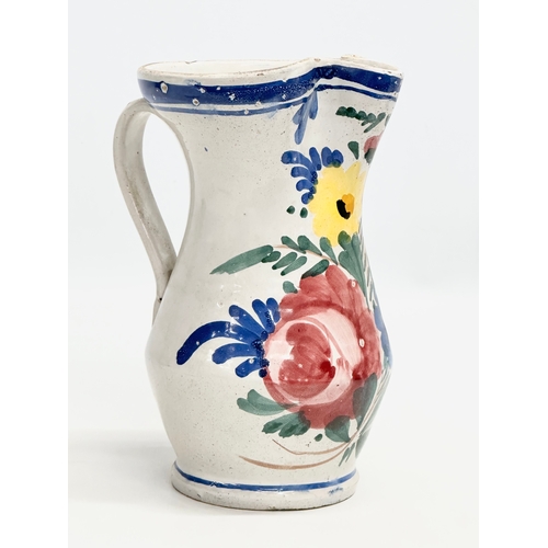 86 - A 19th Century Italian Majolica pitcher. 13x15x19.5cm.