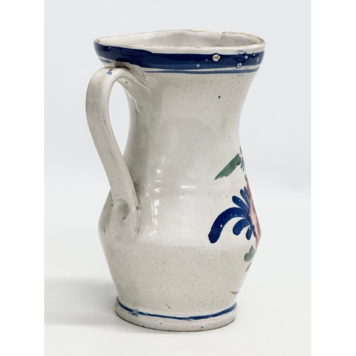 86 - A 19th Century Italian Majolica pitcher. 13x15x19.5cm.