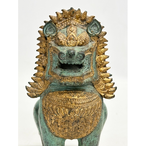 2 - A Late 19th/Early 20th Century Thai gilt bronze Singha Temple Lion. 11x10x20cm.