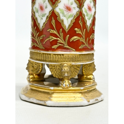 108 - Paris Porcelain. A 19th Century hand painted vase with embossed gilding, raised on 3 winged lion paw... 