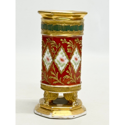 108 - Paris Porcelain. A 19th Century hand painted vase with embossed gilding, raised on 3 winged lion paw... 