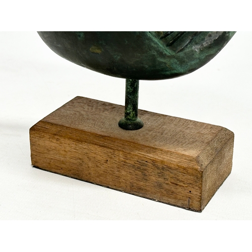 65 - A 20th Century bronze fish sculpture on wooden base. 17x15cm.