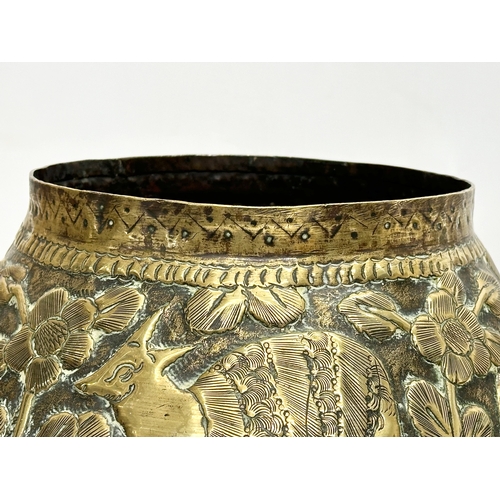 111 - A Mid 19th Century Indian/Burmese embossed brass jardiniere/planter. With deers, elephants, leopards... 