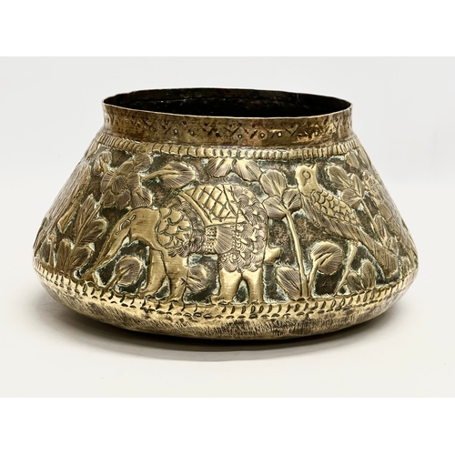 111 - A Mid 19th Century Indian/Burmese embossed brass jardiniere/planter. With deers, elephants, leopards... 