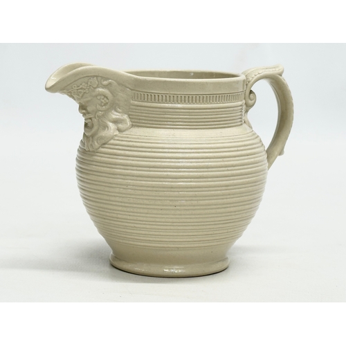 143 - 3 small 19th Century jugs. An Earlu 19th Century Ridgway drap stoneware jug, with Doric spout, 1800-... 