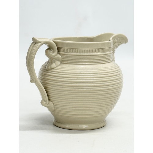 143 - 3 small 19th Century jugs. An Earlu 19th Century Ridgway drap stoneware jug, with Doric spout, 1800-... 