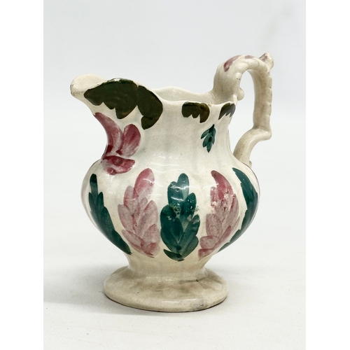 143 - 3 small 19th Century jugs. An Earlu 19th Century Ridgway drap stoneware jug, with Doric spout, 1800-... 