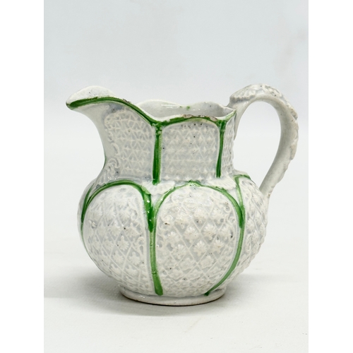 143 - 3 small 19th Century jugs. An Earlu 19th Century Ridgway drap stoneware jug, with Doric spout, 1800-... 