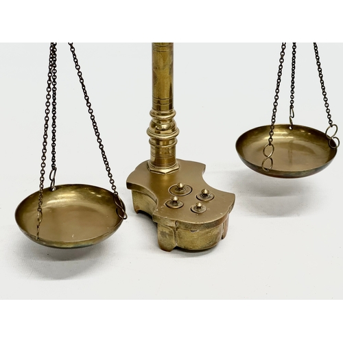 32 - An Early 20th Century brass weight scales. 22x35cm.