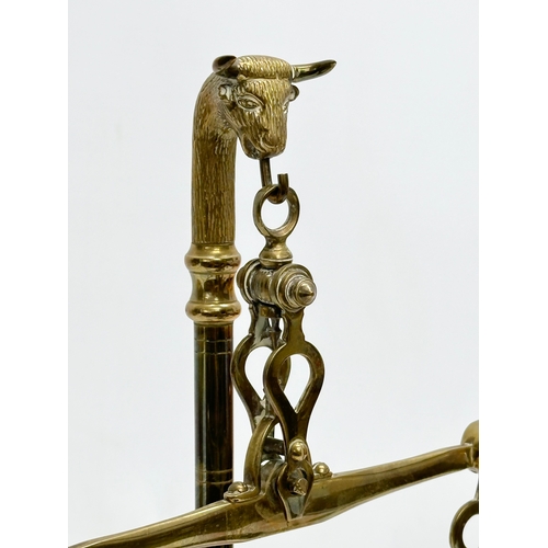 32 - An Early 20th Century brass weight scales. 22x35cm.