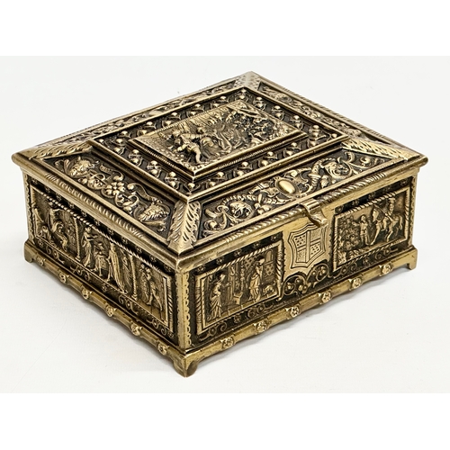 54 - A Late 19th/Early 20th Century brass moulded cigar box, with medieval scenes. 17x17x8cm.