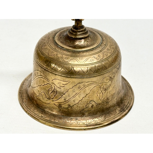 159 - A Late 19th Century Burmese style brass bell. 10x18cm.