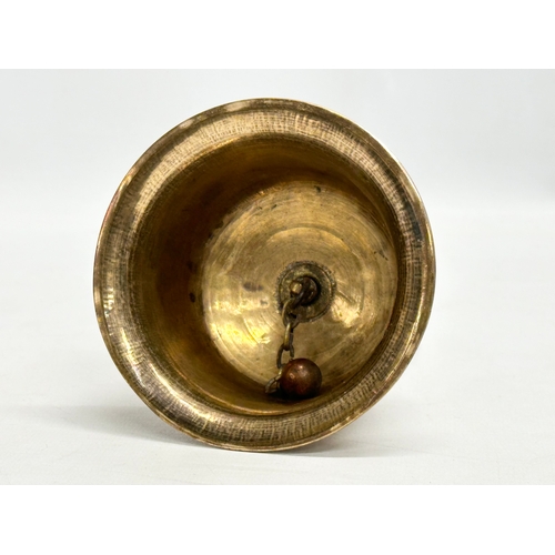 159 - A Late 19th Century Burmese style brass bell. 10x18cm.