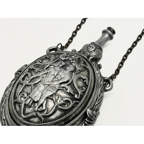 164 - A 20th Century German powder flask style moulded hanging. 35cm including chain.