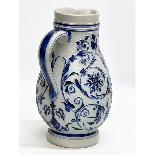 173 - A Late 19th Century German salt glazed pitcher. Westerwald. 18x27cm.