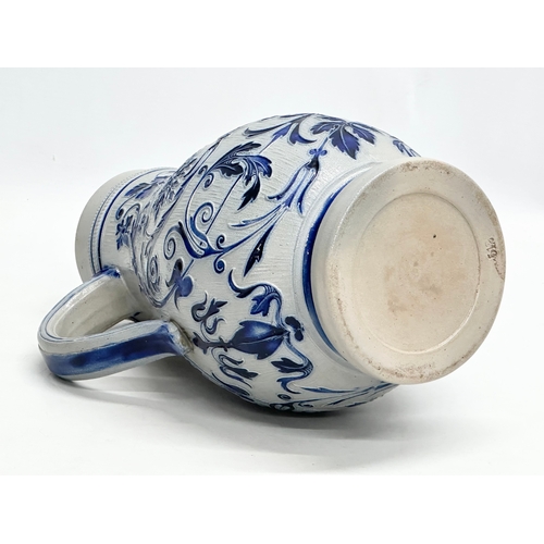 173 - A Late 19th Century German salt glazed pitcher. Westerwald. 18x27cm.