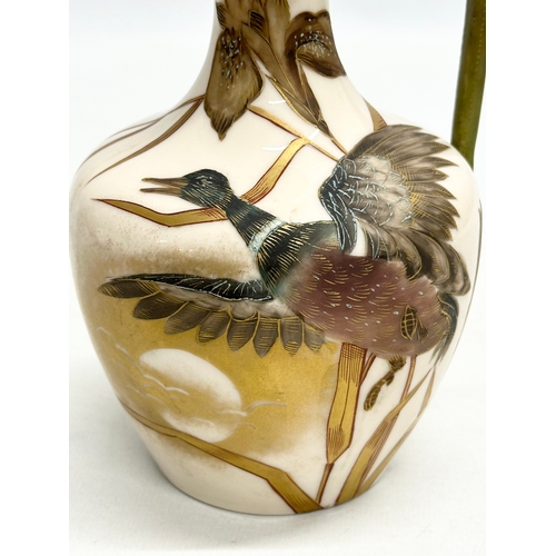 174 - A Late 19th Century hand painted pottery ewer. With bird in flight, gilt clouds and full moon on a b... 