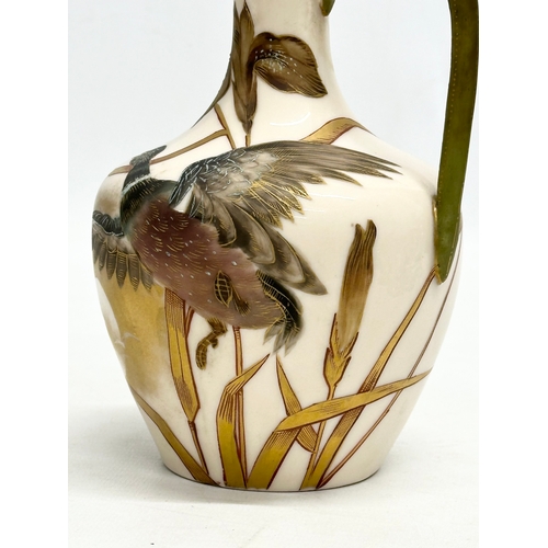 174 - A Late 19th Century hand painted pottery ewer. With bird in flight, gilt clouds and full moon on a b... 