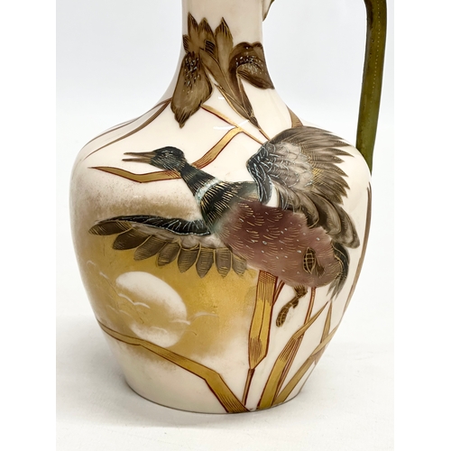 174 - A Late 19th Century hand painted pottery ewer. With bird in flight, gilt clouds and full moon on a b... 