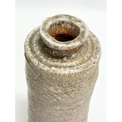 178 - A signed Mid 20th Century Japanese Shigaraki bottle style vase. 11x24cm.