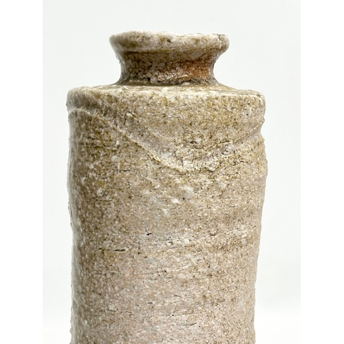 178 - A signed Mid 20th Century Japanese Shigaraki bottle style vase. 11x24cm.