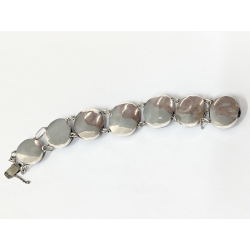 486 - A silver and ornate stone bracelet.