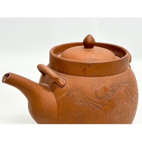 35 - A signed Early 20th Century Chinese Yixing teapot. Impressed mark. 22x14x16cm.