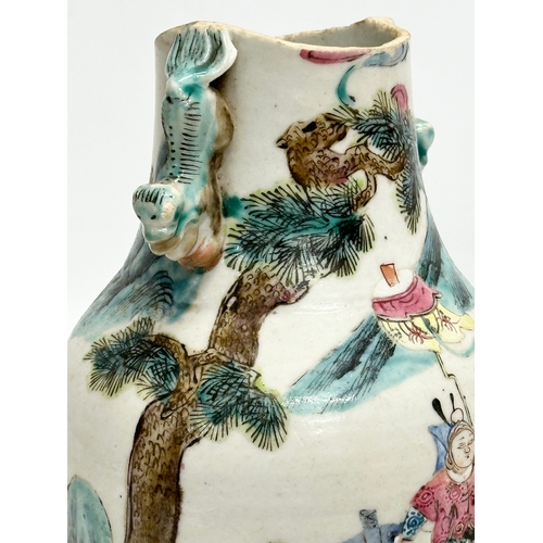 201 - A 19th Century Chinese Late Qing Dynasty vase. Decorated by 2 foo dog handles, god and immortals on ... 