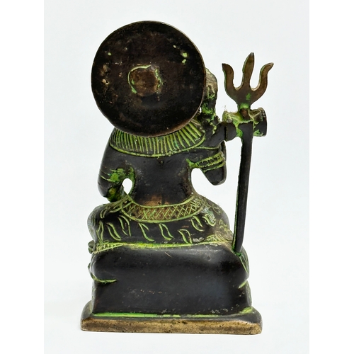 202 - A small Early 20th Century bronze Hindu sitting Shiva statue. 12cm