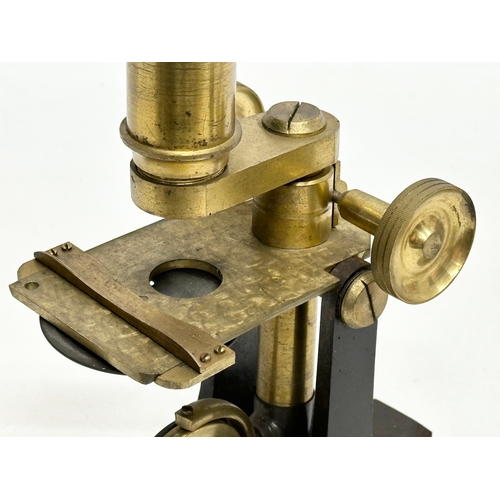 198 - Newton & Co. Temple Bar London. A Late 19th Century bras microscope by Newton & Co. Circa 1870-1890.... 